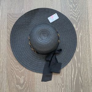 Black summer hat with gold trimmed ribbon